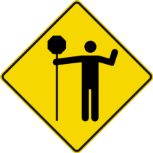 Traverse contrôlée par un signaleur (bâton)