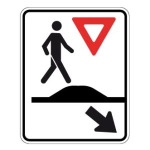 Passage pour piétons sur un dos d'âne allongé ou un carrefour surélevé